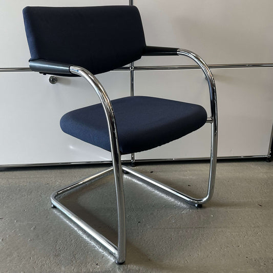Vitra Visavis softback chair in dark blue with padded backrest and chrome frame