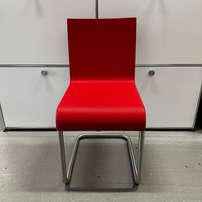 Vitra .05 Maarten van Severen chair with stainless steel frame and signal red polyurethane seat designed for indoor and outdoor use
