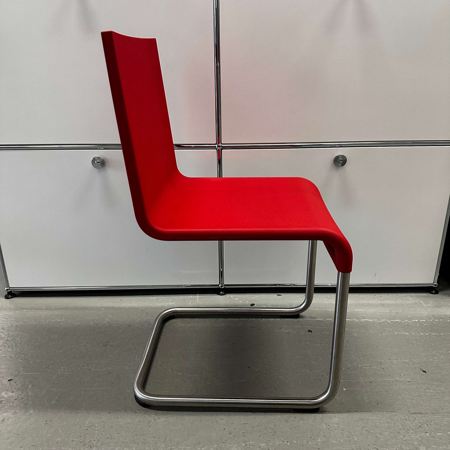 Vitra .05 Maarten van Severen chair with stainless steel frame and red polyurethane seat shell
