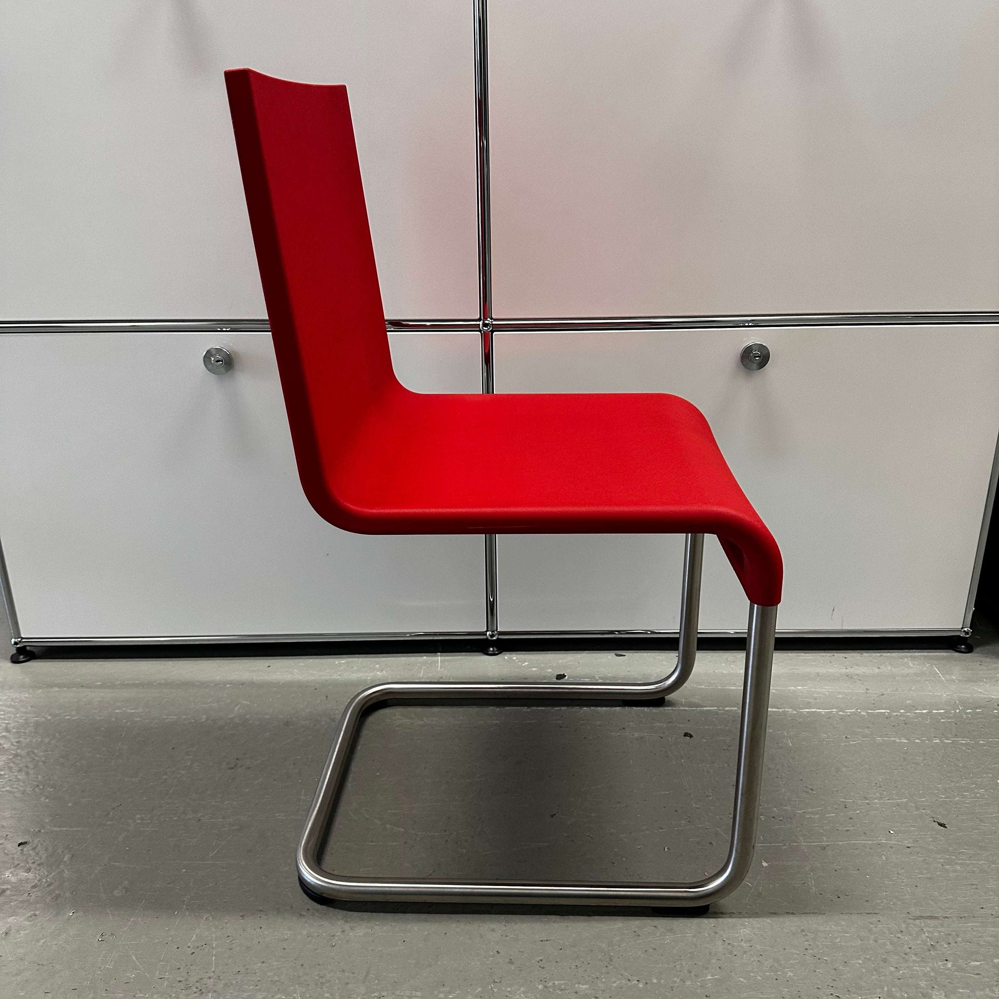 Vitra .05 Maarten van Severen chair with stainless steel frame and red polyurethane seat shell