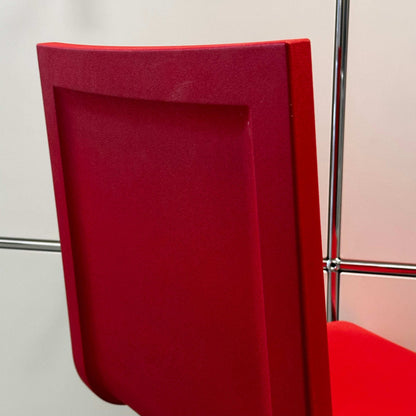 Red Vitra .05 Maarten van Severen chair with stainless steel frame and flexible polyurethane seat shell