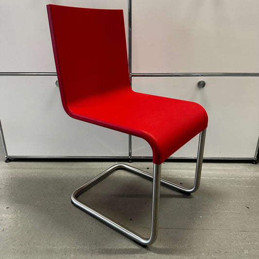 Vitra .05 Maarten van Severen chair with red polyurethane seat and stainless steel cantilever frame