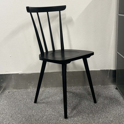 Black Wagner W-1960 Chairity wooden chair with a minimalist modern design and ergonomic backrest.