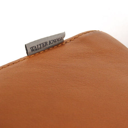 Close-up of Walter Knoll Living Landscape 730 sofa in cognac leather with brand tag.
