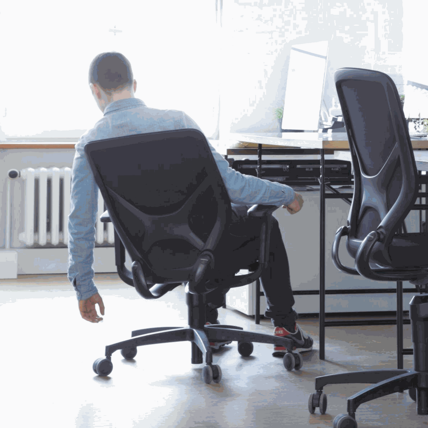 Ergonomic Wilkhahn IN office chair with black fabric, soft casters, adjustable height, 3D armrests, and lumbar support