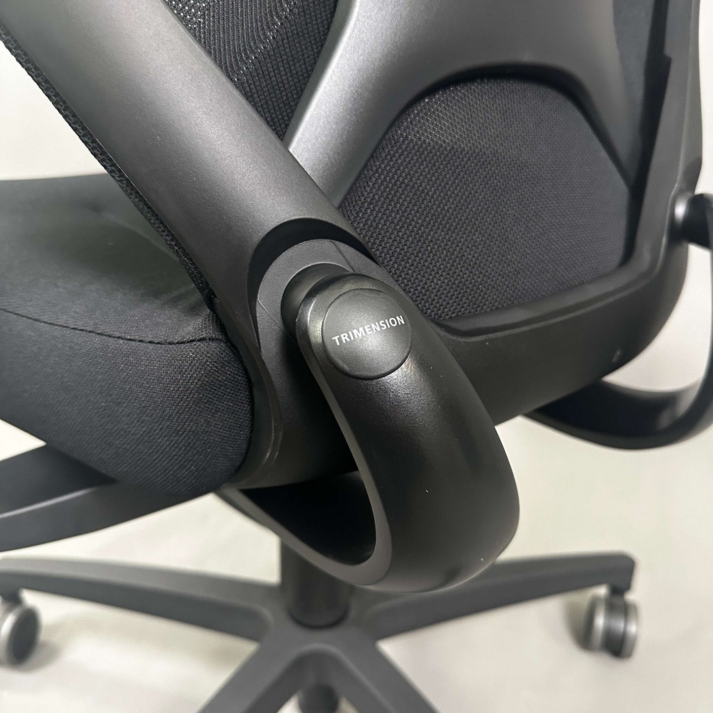 Wilkhahn IN office chair with black fabric, soft wheels for hard floors, 3D armrests, and trimension adjustment.