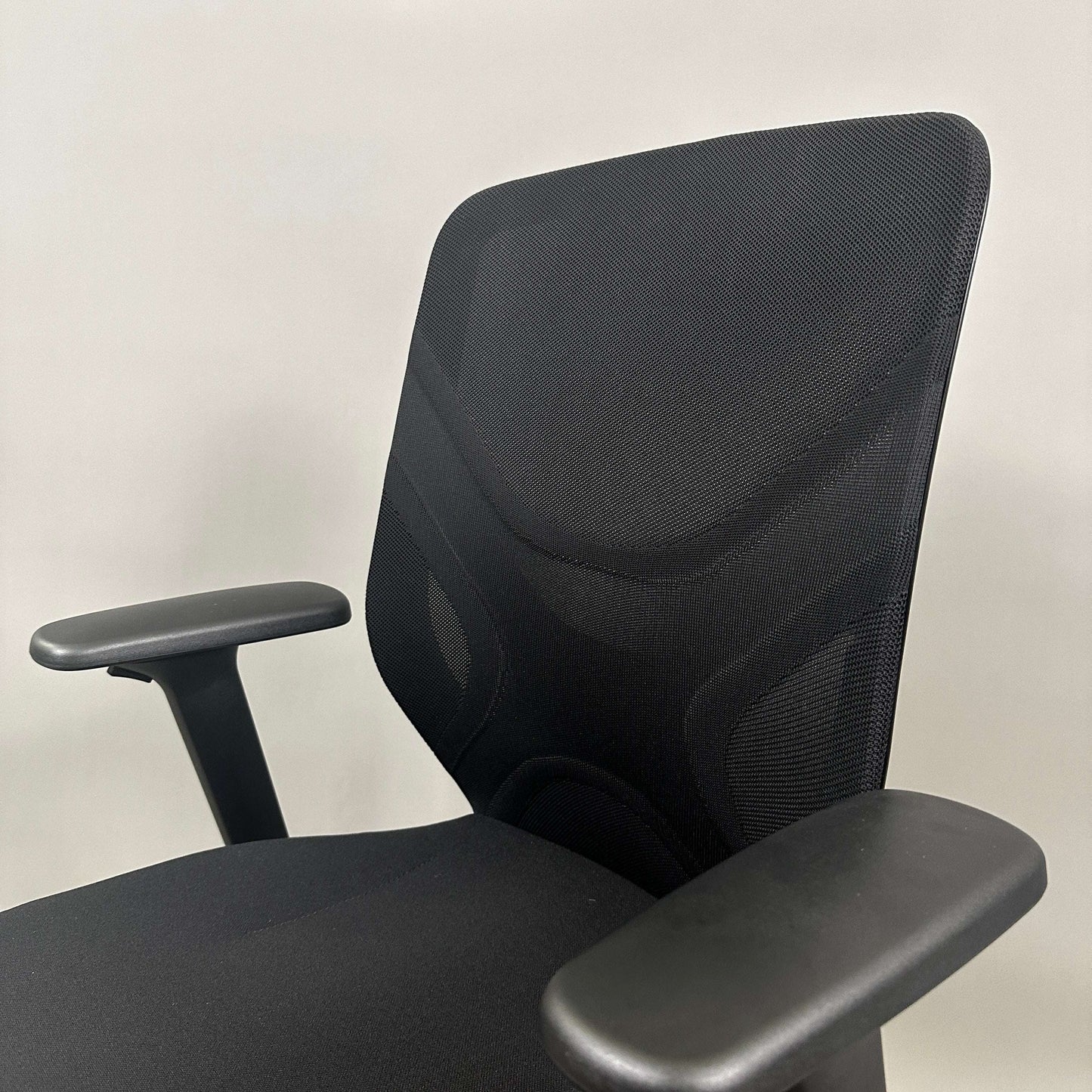 Wilkhahn IN ergonomic black office chair with adjustable height, 3D armrests, and soft wheels for hard floors