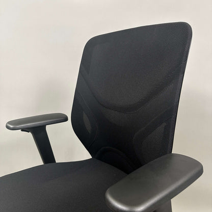 Wilkhahn IN ergonomic black office chair with adjustable height, 3D armrests, and soft wheels for hard floors
