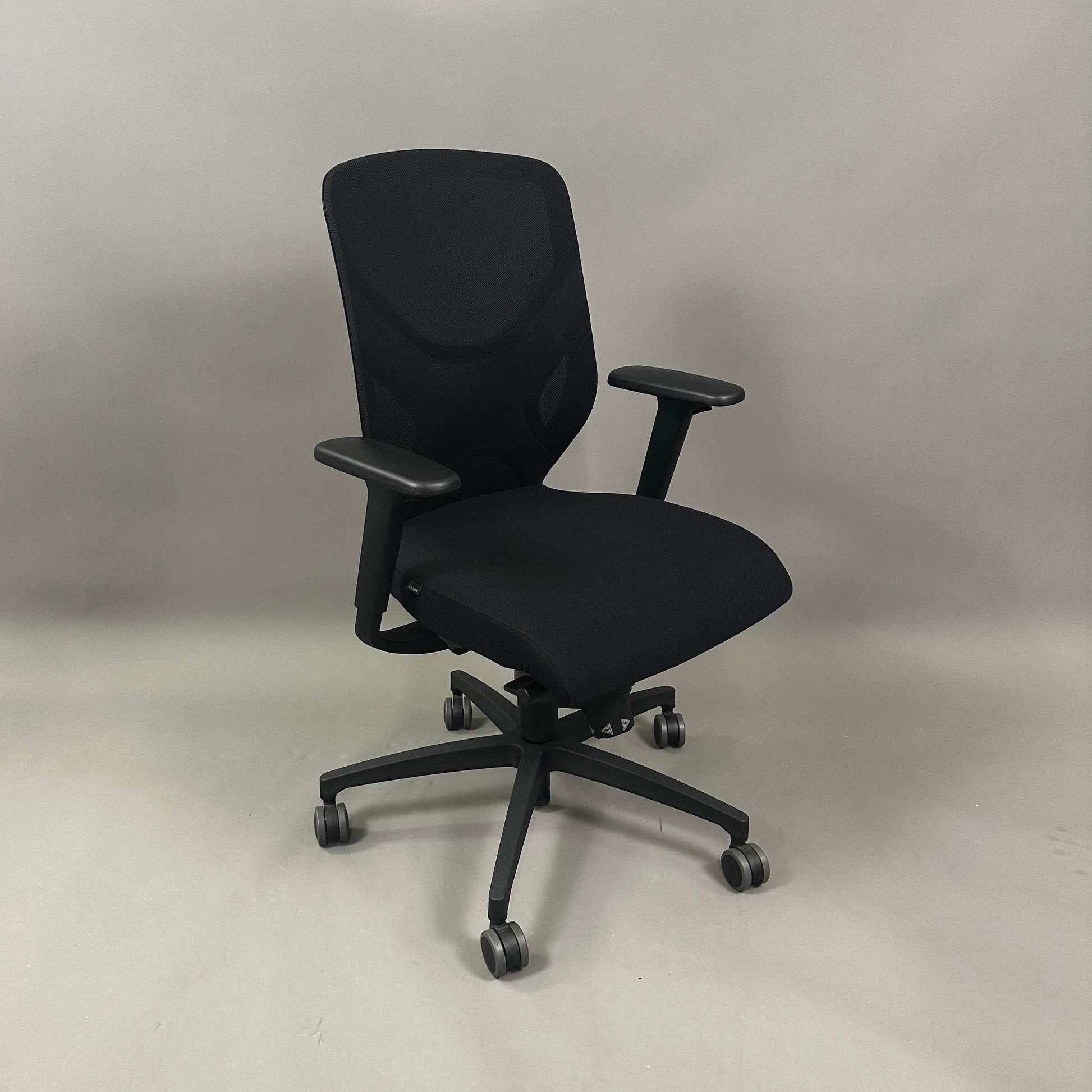 Wilkhahn IN ergonomic office chair with black fabric, adjustable height, 3D armrests, and soft wheels for hard floors.