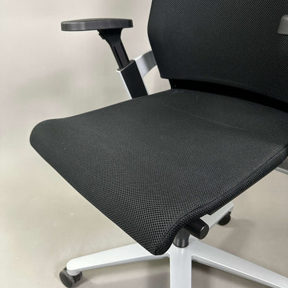 Black mesh and fabric Wilkhahn ON office chair with adjustable armrest and white aluminum base