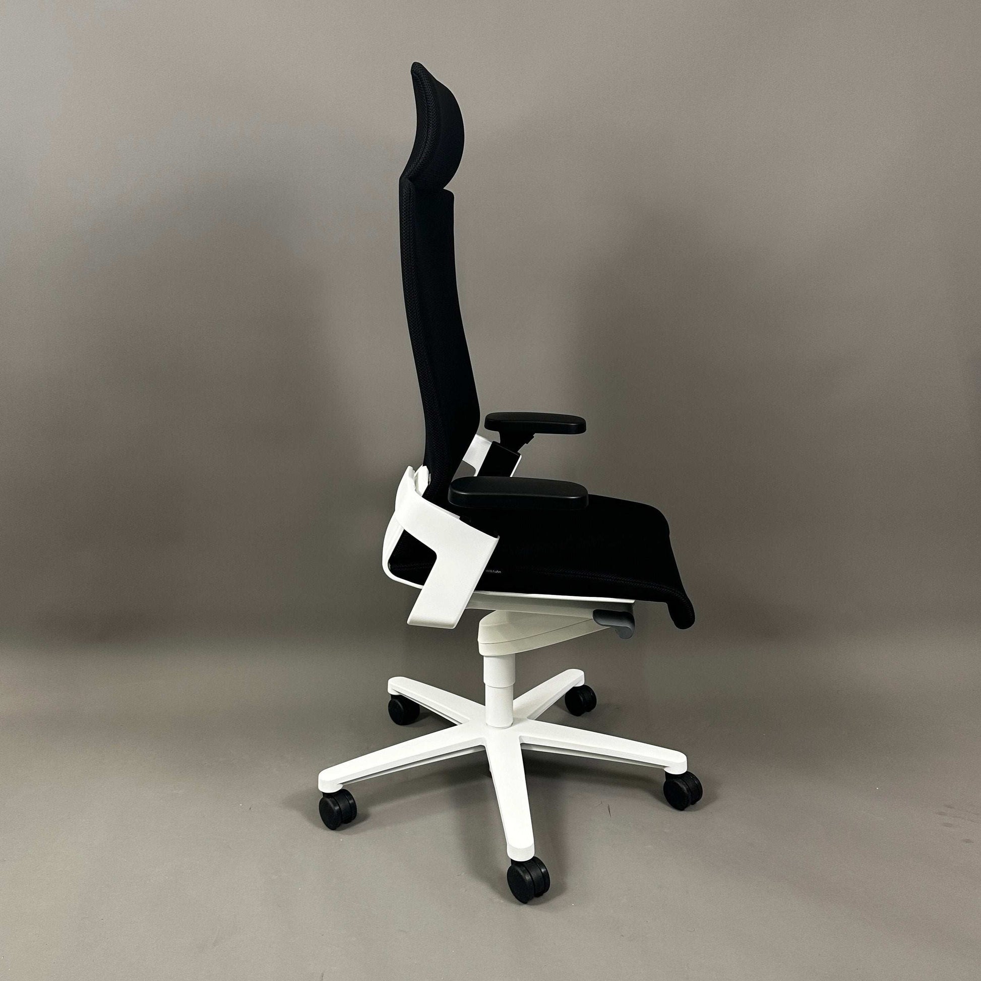 Wilkhahn ON ergonomic office chair with high back, black Fiberflex seat, white plastic base, and adjustable features