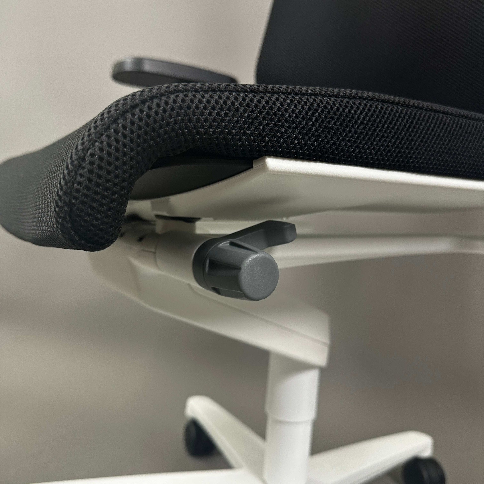 Wilkhahn ON ergonomic office chair with black Fiberflex seat and white plastic base with adjustable features