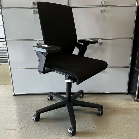 Black Wilkhahn ON office chair with adjustable seat height, depth, and backrest, on caster wheels