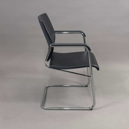 Wilkhahn Sito chair with black leather seat and chrome frame side view
